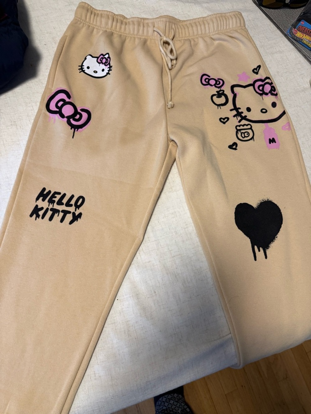 Hello Kitty Beige Sweatpants with Black & Pink Graphics